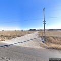 Grass fire near structure on County Road 621
