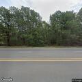 Brush fire beside residence on US Highway 79