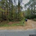 Brush fire in woods near Russell Camp Road home