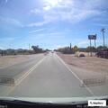 Car speeding on Picture Rocks and Sandario Road