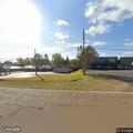 Vehicles blocking traffic lane near State Farm lot