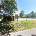 Woman with breathing trouble and vomiting at Pine Bluff Rd