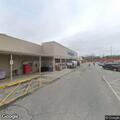 Woman in damaged car asking for money at Food Lion