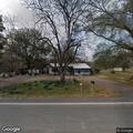 Grass fire in yard along Highway 135