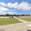 Teen male with head and neck injury at football field