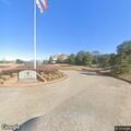 Person experiencing chest pain at golf clubhouse
