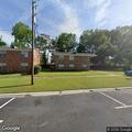 Person looking into apartments at Danya Court