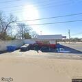 Female sleeping in parking lot with possible juvenile nearby