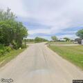 Vehicle in ditch with person on car roof
