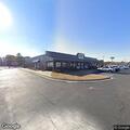 Officer checks suspicious vehicle behind restaurant