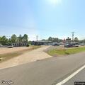 Delivery truck hits parked car in parking lot