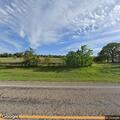 Large grass fire threatening structure near Lipan