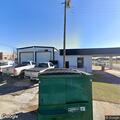 Traffic stop at auto shop on gray GMC pickup