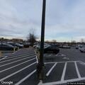 Traffic stop on white Acura in store parking lot