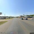 Male slumped over inside truck at highway intersection