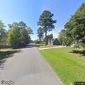Officer checks yard damage on Sand Valley Lane
