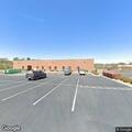Officer checks suspicious vehicle in parking lot