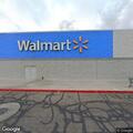 Trespassed person walking toward nearby Walmart