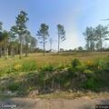 Small brush fire in woods on Bluebird Road