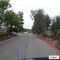 Person behind wheel of car blocks road on Penasco Road