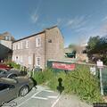 Officer checks door alarm on Wentworth Street
