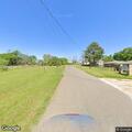 Man lying on grass near street during welfare check