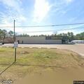 Person found lying covered on sidewalk at Dollar General