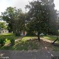 Tree on house with sparking power line in Avinger