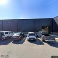 Man with slingshot arguing in clinic parking lot