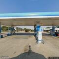 Woman with high blood pressure and breathing issues at gas station