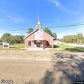 Grass fire caused by downed power line near church