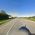 Vehicle crashes off I-90 into woods and flips over
