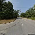 Traffic stop on red Toyota Avalon at intersection