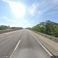 Traffic stop with gray Chevy on decel ramp