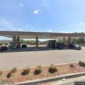 Vehicles block each other at gas station