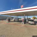 Traffic stop at Circle K on black Dodge Charger