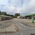 Officer checks suspicious vehicle behind gas station