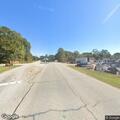 Officer directs traffic for road line work