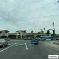 Blue minivan stopped on highway, likely out of gas