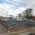 Kitten trapped under car at auto business