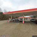 Woman bothering customers at gas station lot