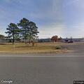 Burn pile reported in front yard on Highway 82
