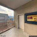 Person experiencing abdominal pain at bus stop