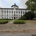 Psychiatric patient sitting outside hospital steps