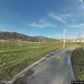 Person with breathing problem at sports park field