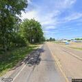 Broken utility pole leaning near Highway 82
