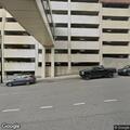 Person dehydrated at university parking deck