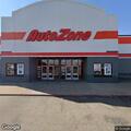 Two men arguing inside auto parts store