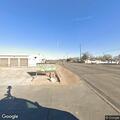Officer checks person with device near I-27