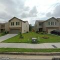 Suspicious man with golf club behind home